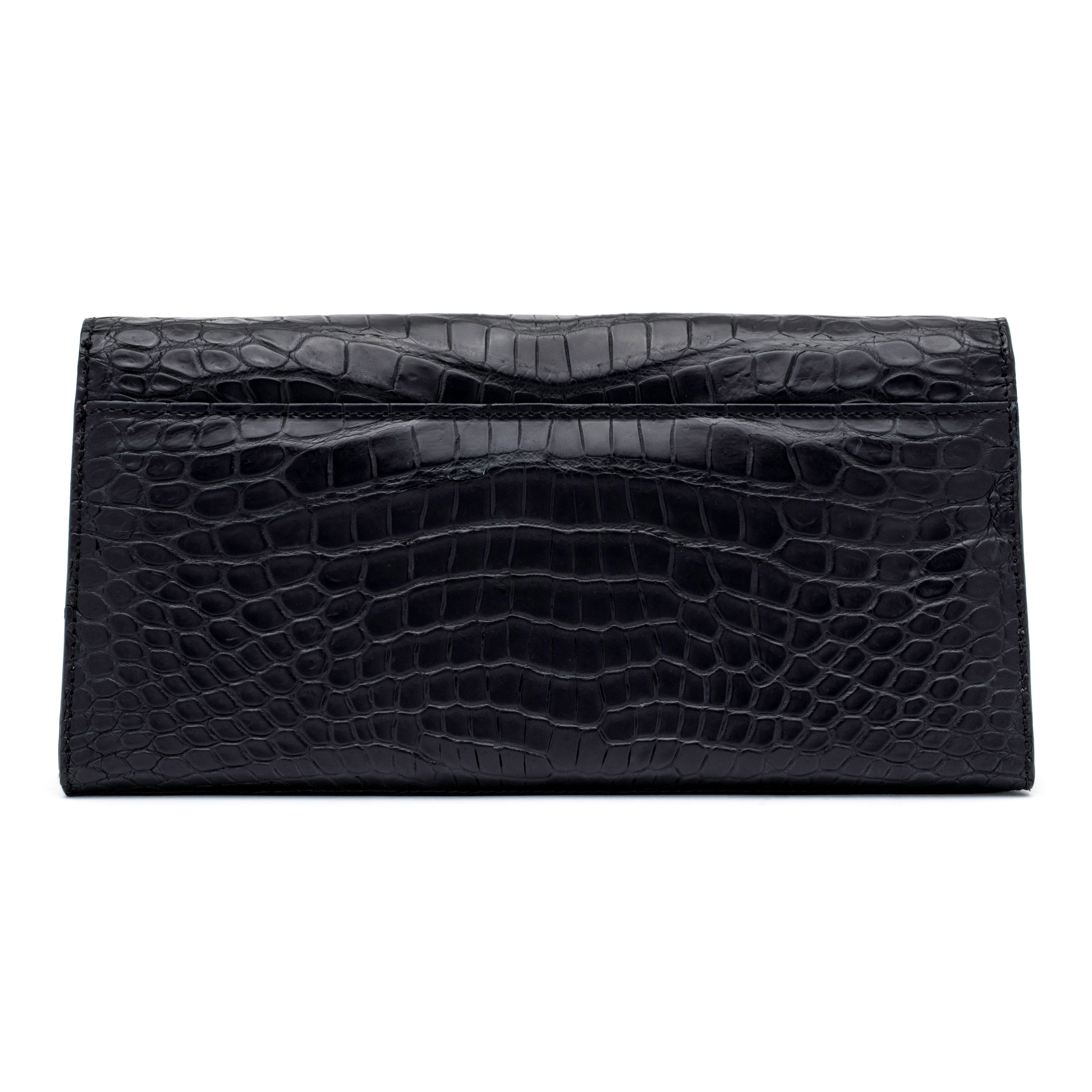 The Rio Clutch Bi-Color in Black and Gold