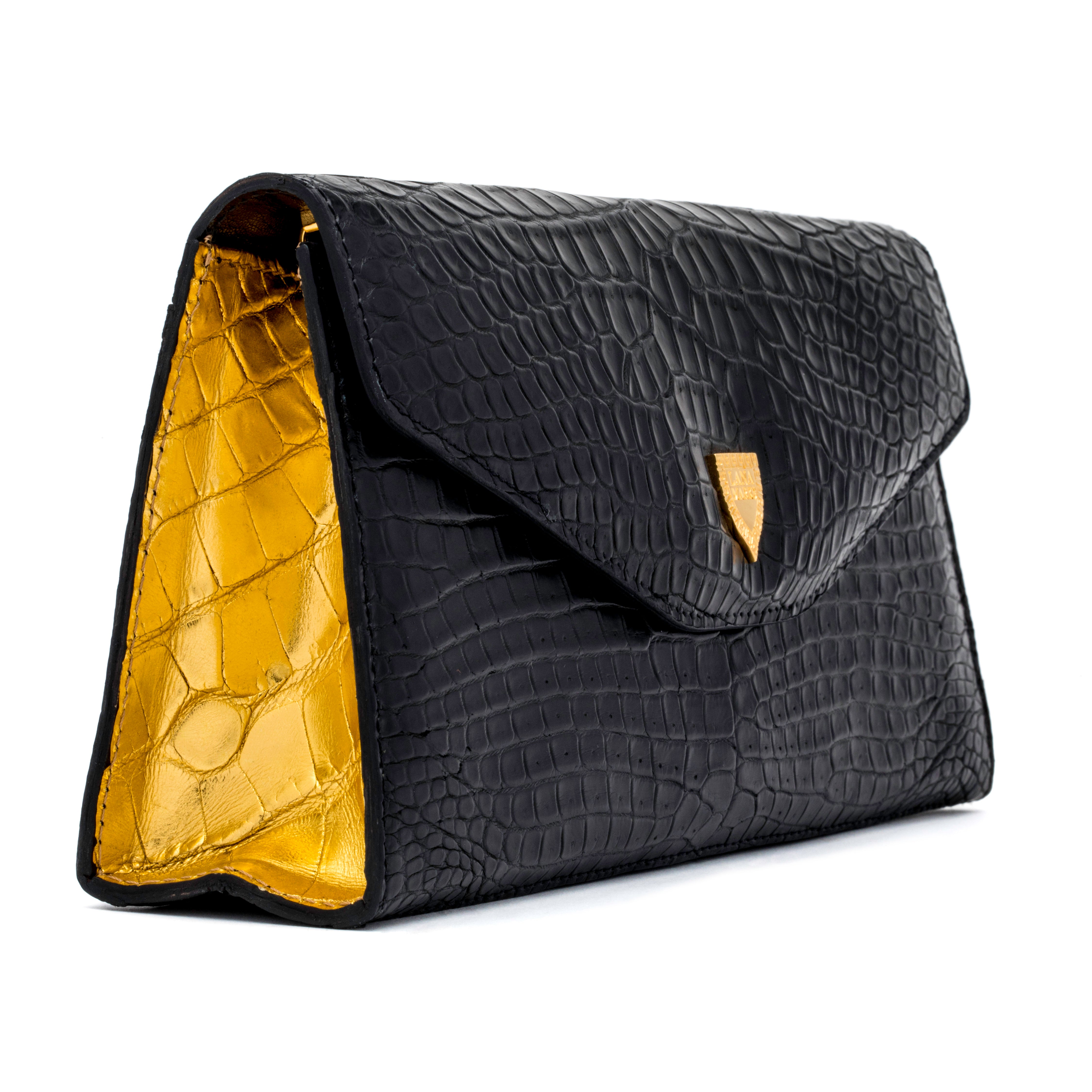 The Rio Clutch Bi-Color in Black and Gold